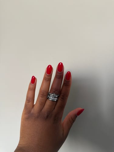 Customer's Forever Link Crystal & Silver Ring worn on a hand with red nail polish.