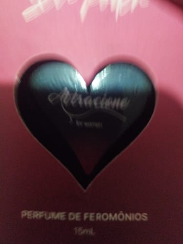 Customer's Attracione Sensual perfume packaging, highlighting the heart-shaped window cutout.