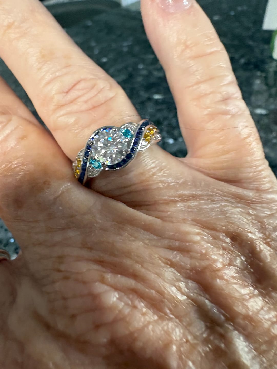 Customer photo review of Starry Night Moissanite Artistic Swirl Accent Engagement Ring