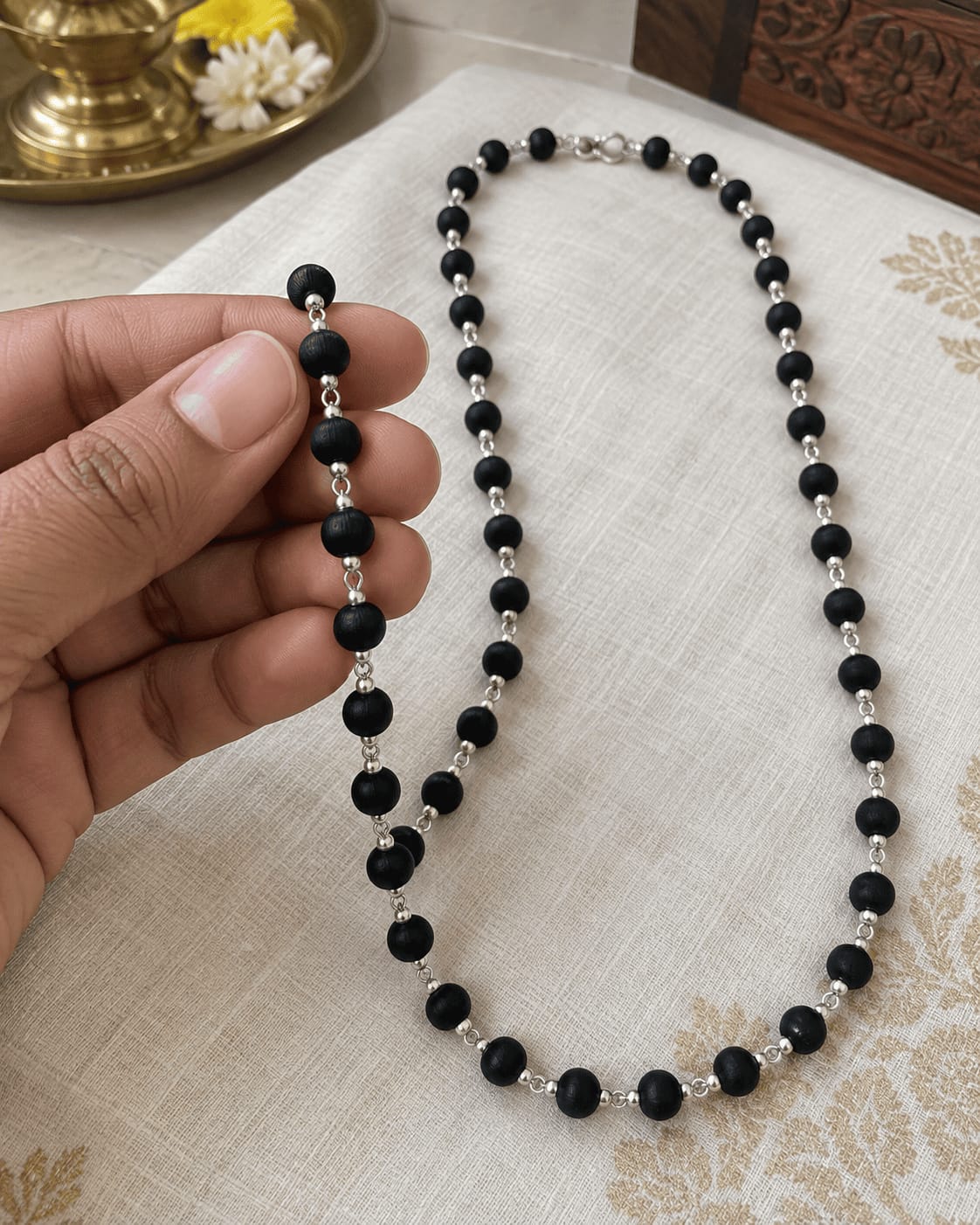 Customer photo review of Karungali Mala with Silver-Plated Chain