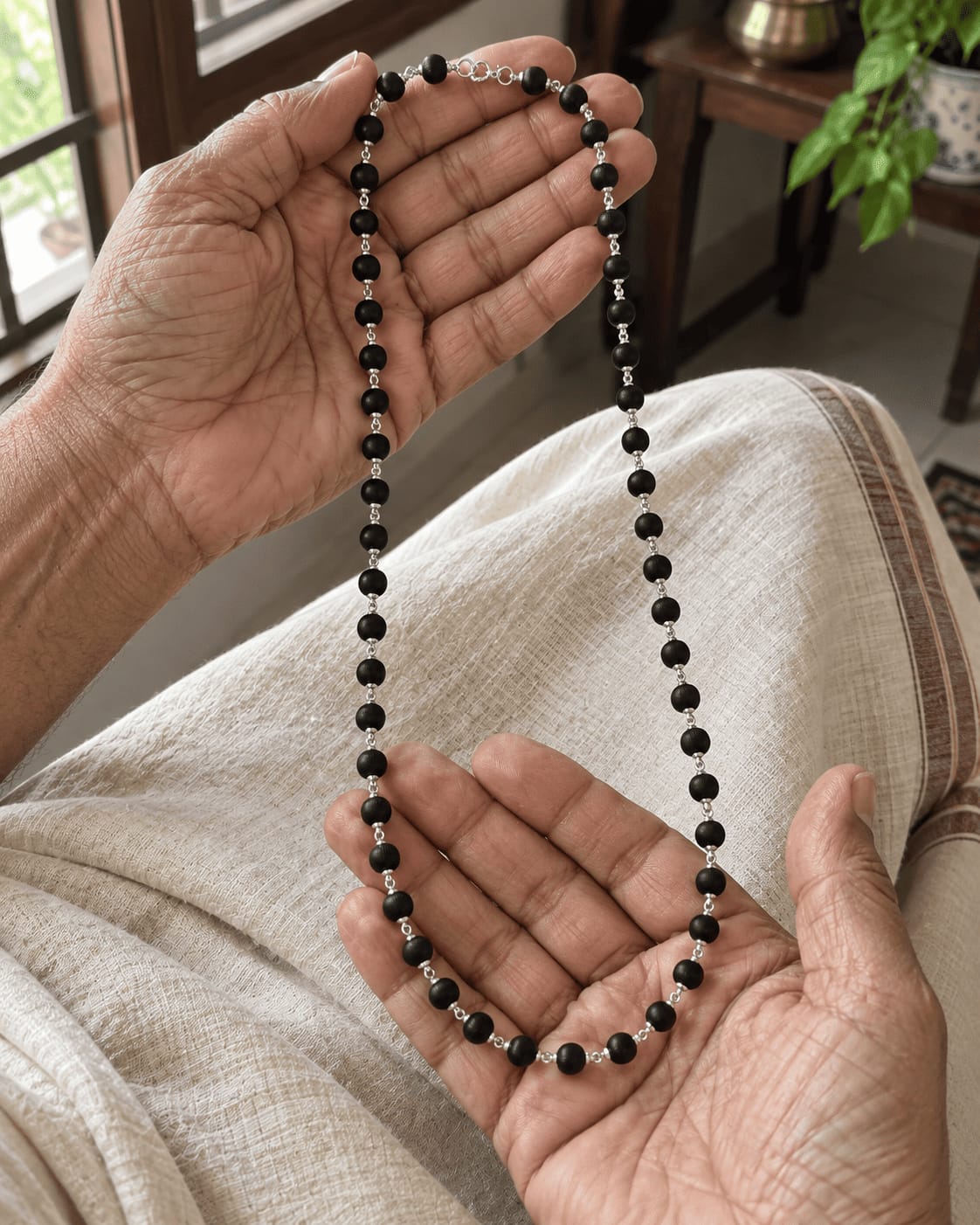 Customer photo review of Karungali Mala with Silver-Plated Chain