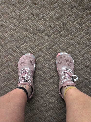 Customer's Smart II barefoot shoes, worn on feet against a textured carpet background.