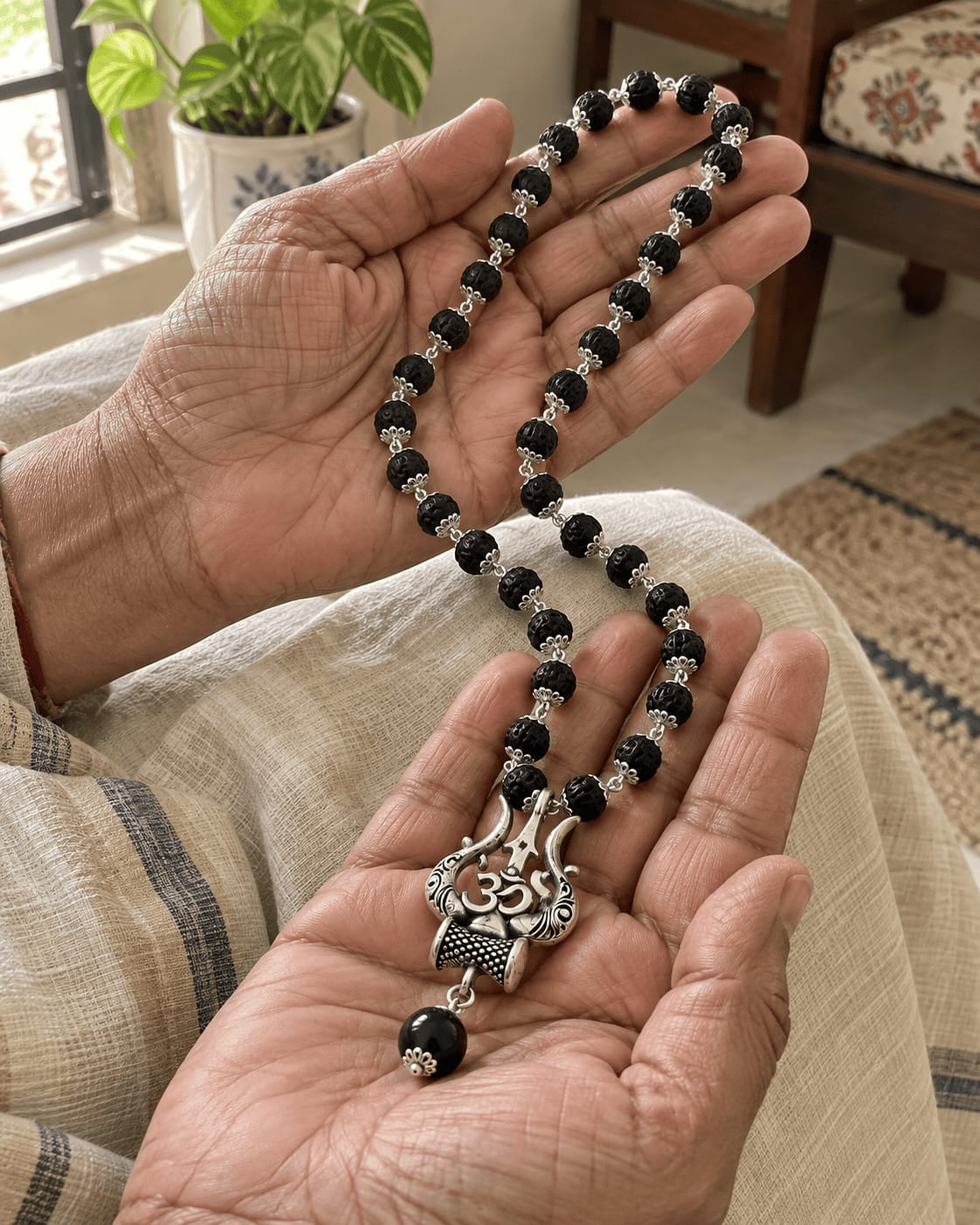 Customer photo review of Original Karungali Mala with Silver Plated Om Trishul Pendant