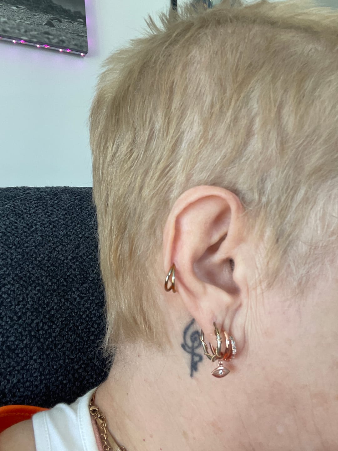 Customer photo review of Evil Eye Sapphire Huggie Earrings