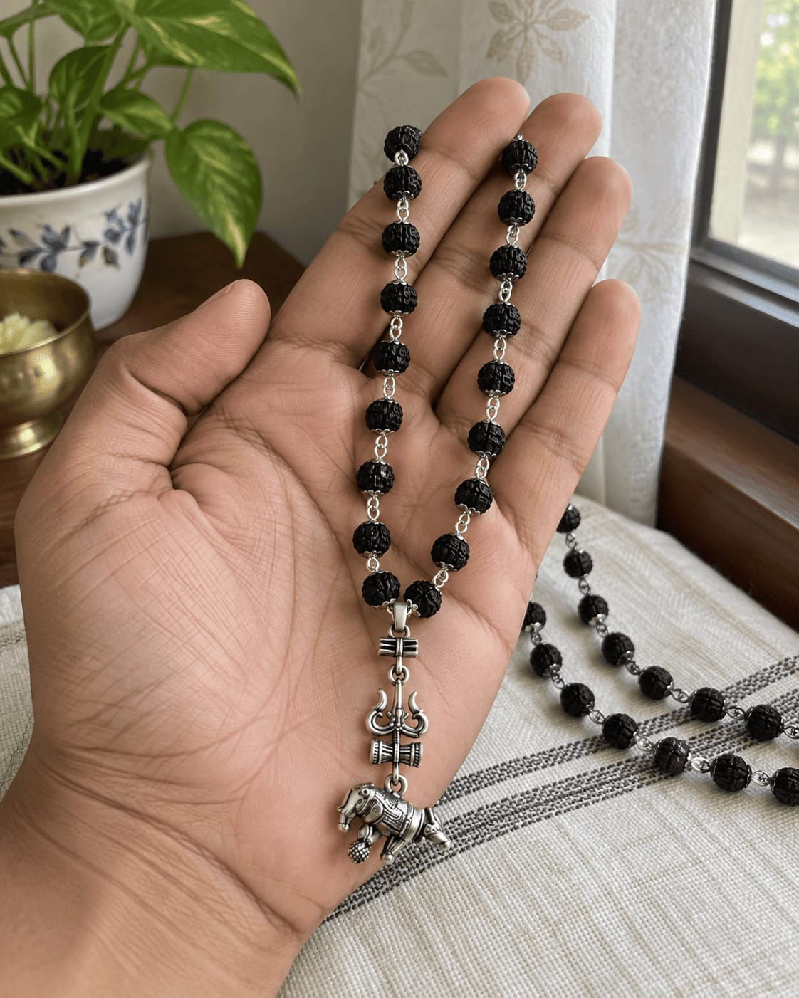 Customer photo review of Original Silver-Plated Karungali Mala with Shiv Trishul Nandi Pendant