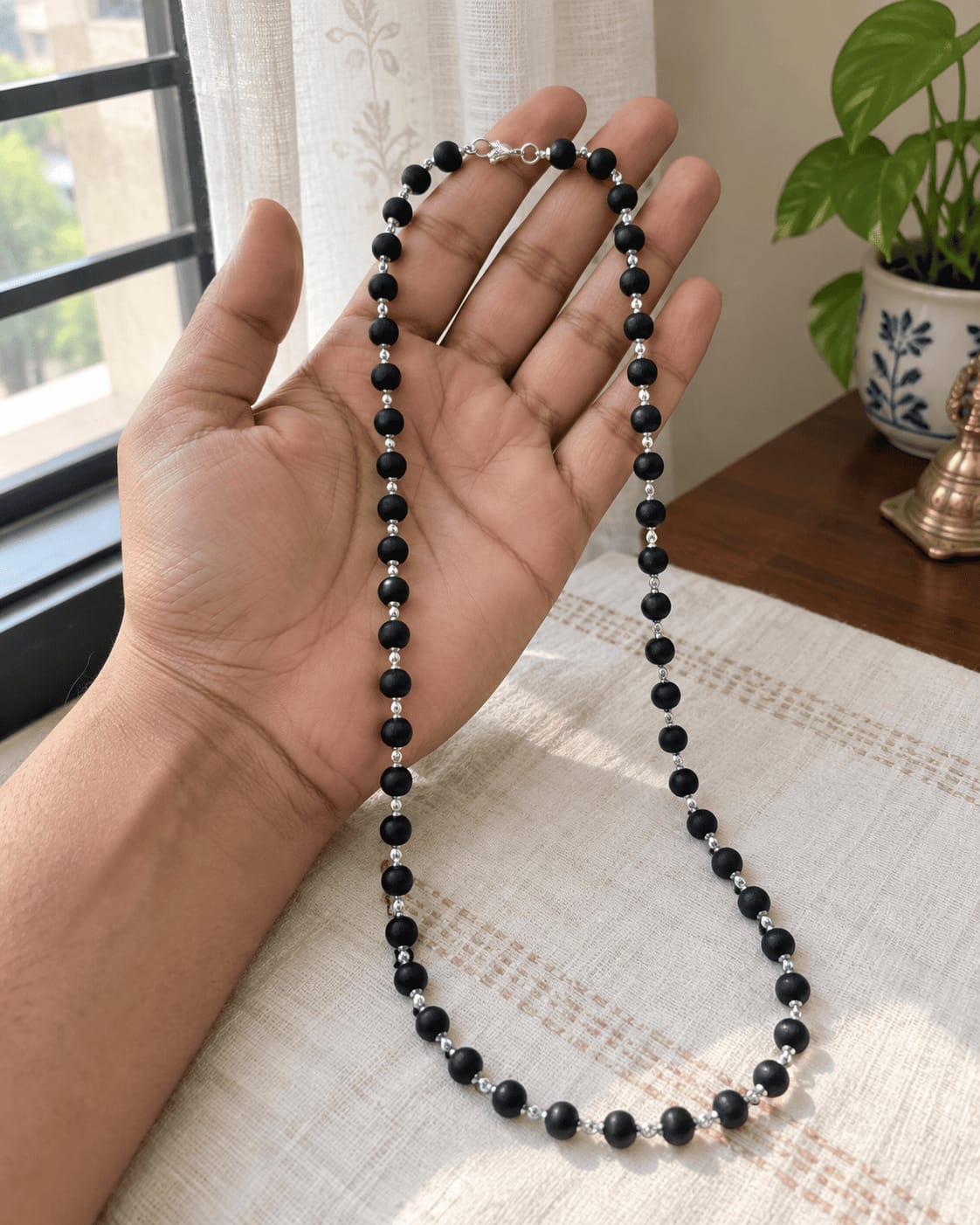 Customer photo review of Karungali Mala with Silver-Plated Chain