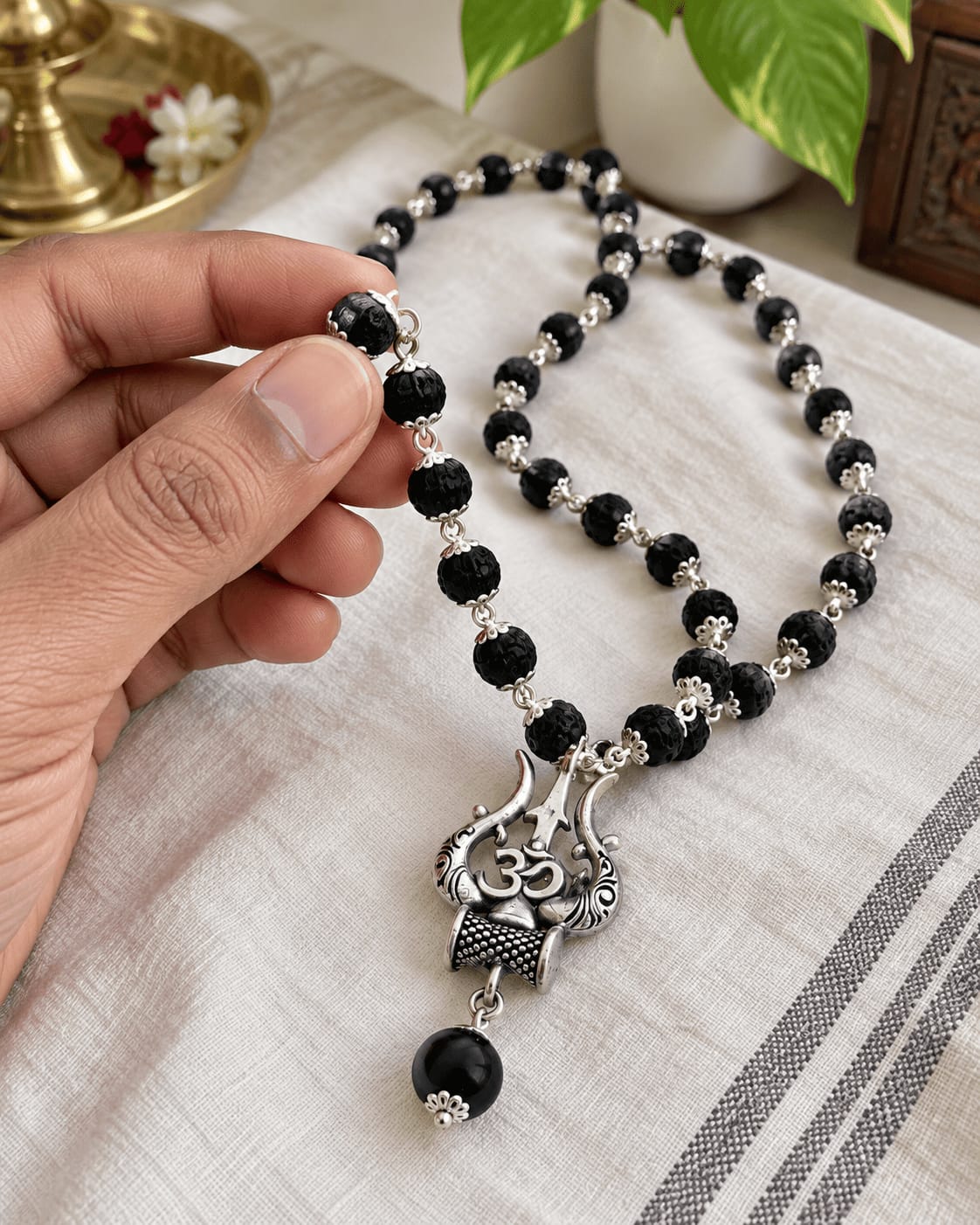 Customer photo review of Original Karungali Mala with Silver Plated Om Trishul Pendant