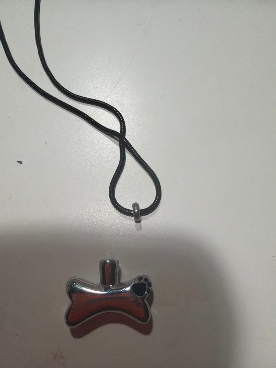 Customer photo review of Cremation Urn Necklace Dog Bone Pendant for Ashes Memorial Jewelry-A006