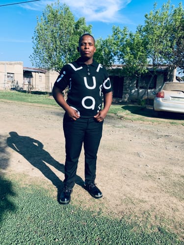 Customer's LFN014B knit top worn with black trousers in an outdoor setting.