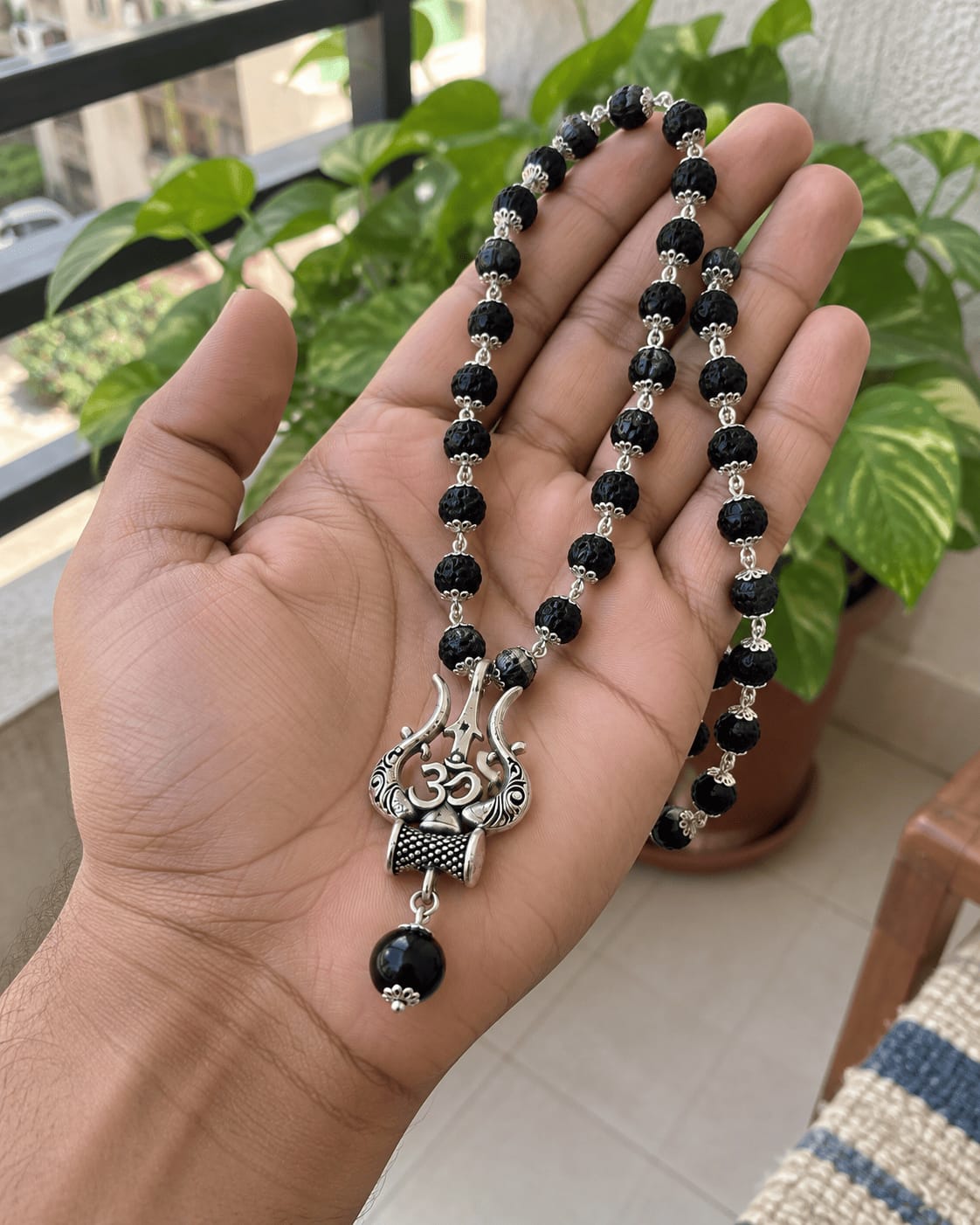 Customer photo review of Original Karungali Mala with Silver Plated Om Trishul Pendant