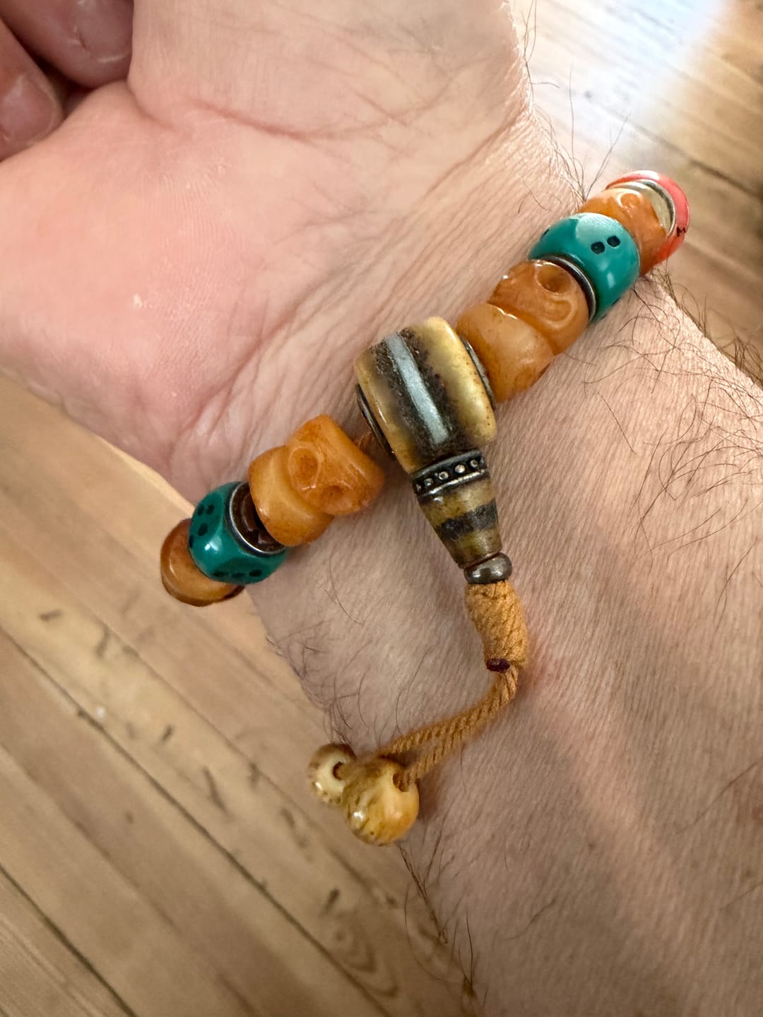 Customer photo review of The "Fearless Dance" Hand-Carved Chitipati Wrist Mala