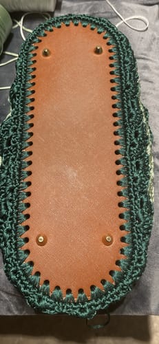 Customer's CrochetPark Brand 2nd Anniversary Box project, showing a dark green crocheted base with a brown insert.