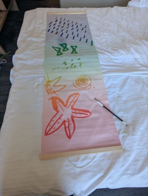 Customer photo review of Magic Drew Colorful Reusable Water Writing Cloth [FREE Water Cup + Brush]