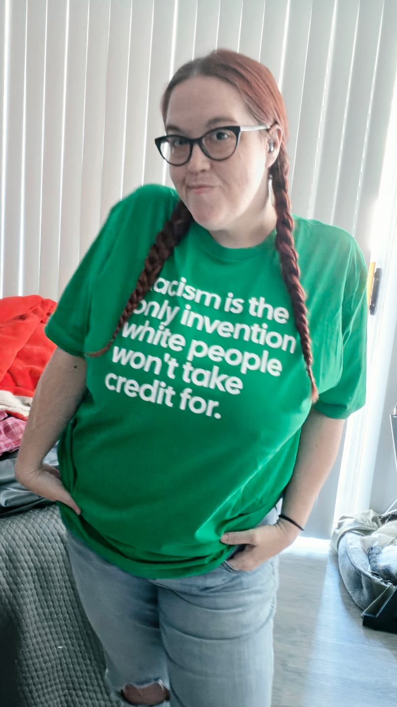 Customer photo review of Racism Is the Only Invention White People Won’t Take Credit For Unisex Tee