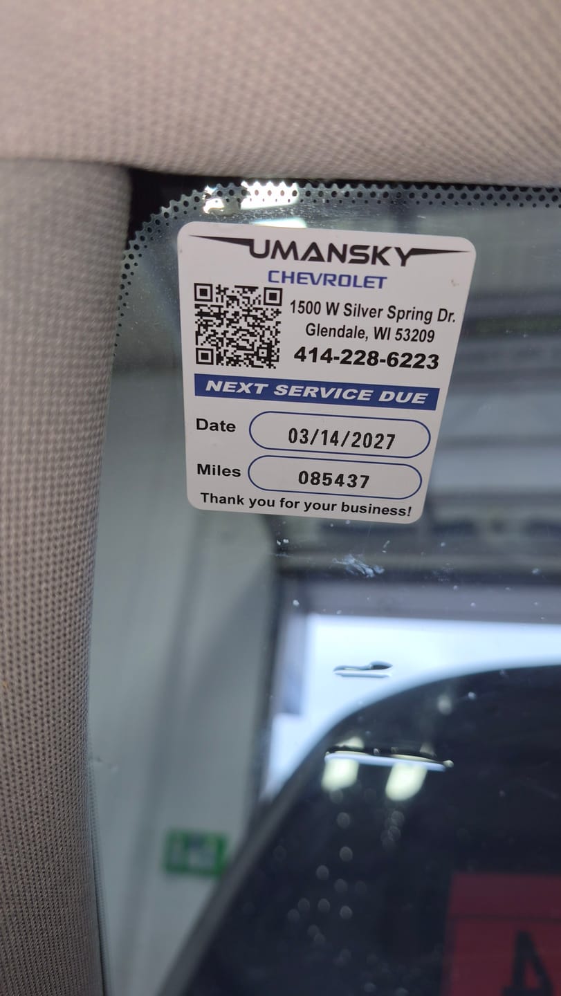 Customer photo review of Custom Oil Change Stickers for Windshield with Logo