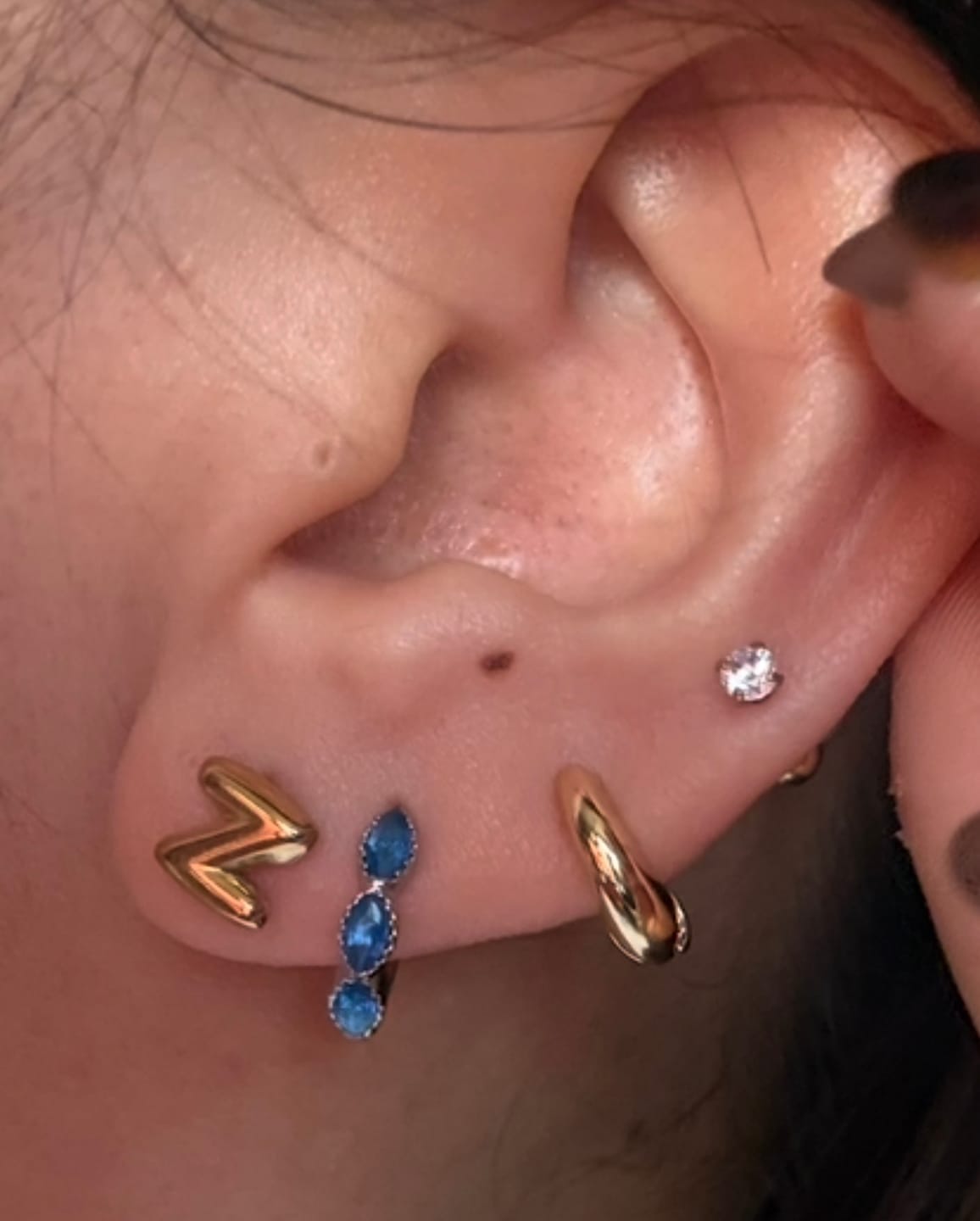 Customer photo review of Aretes Denim Plata
