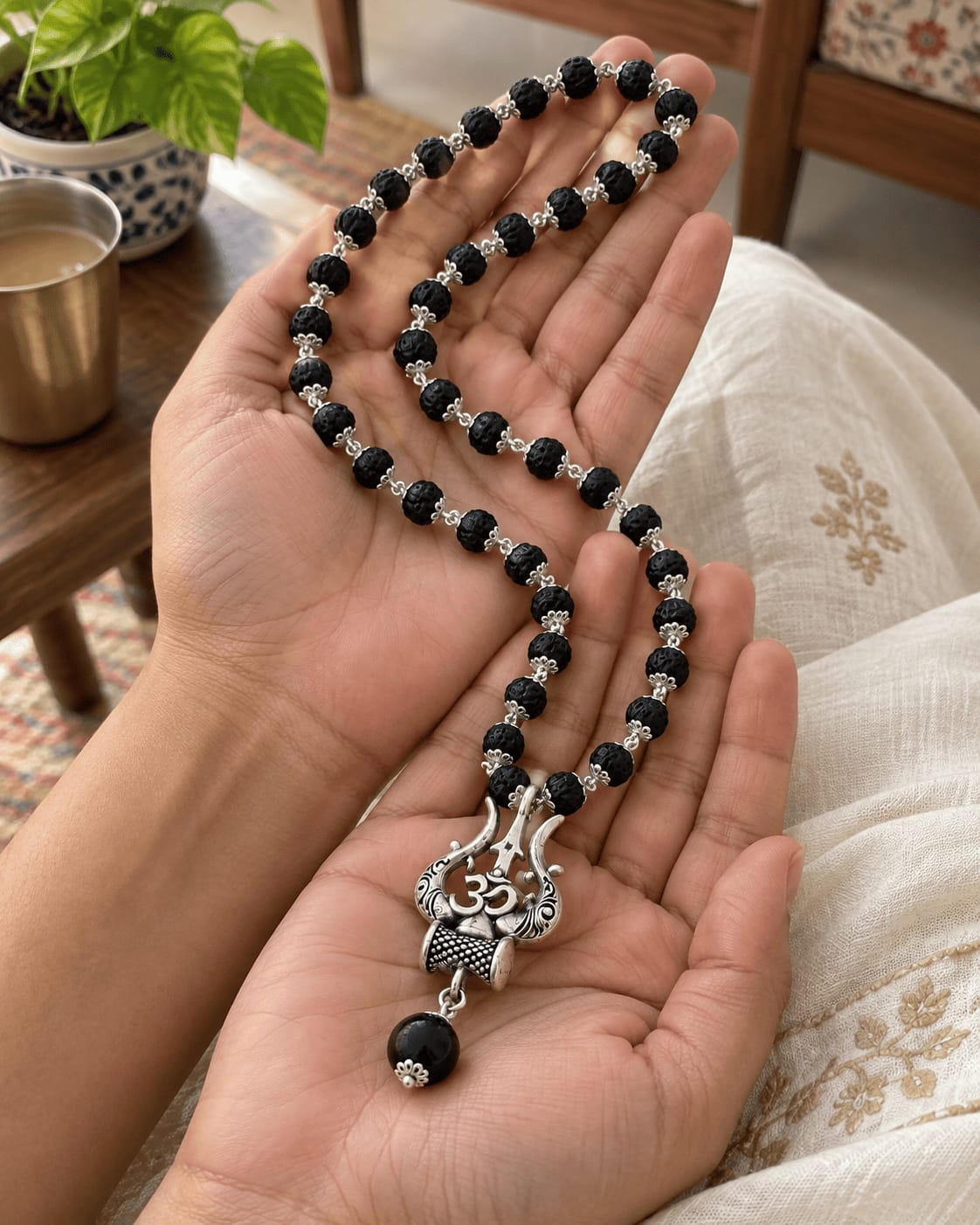 Customer photo review of Original Karungali Mala with Silver Plated Om Trishul Pendant