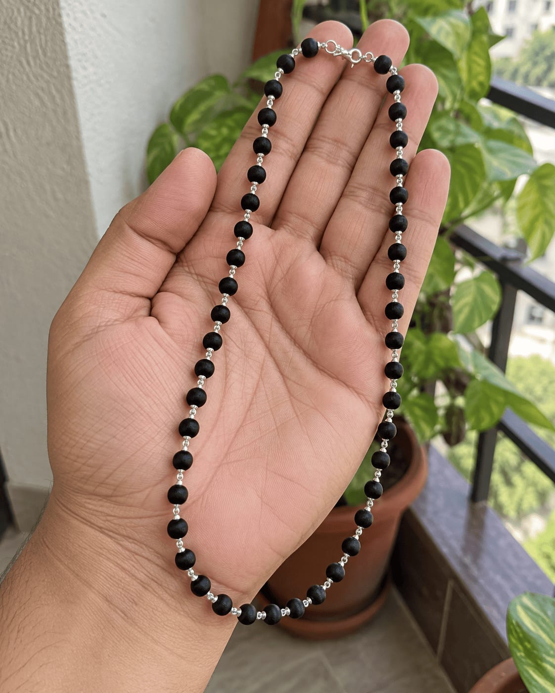 Customer photo review of Karungali Mala with Silver-Plated Chain