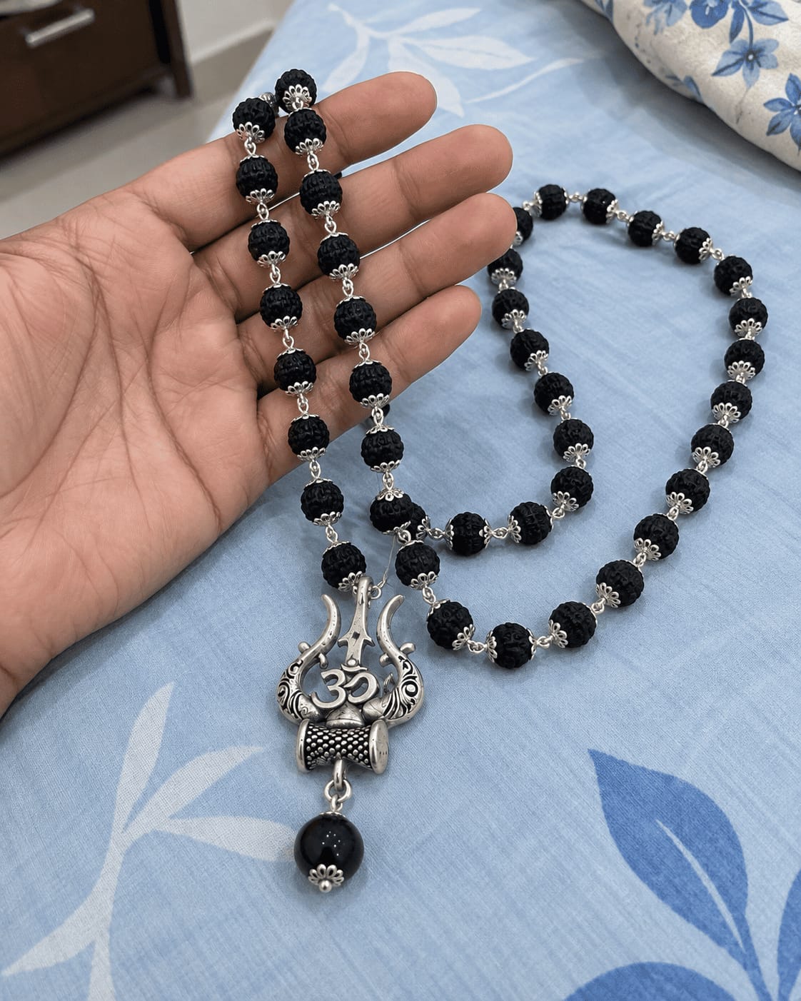 Customer photo review of Original Karungali Mala with Silver Plated Om Trishul Pendant