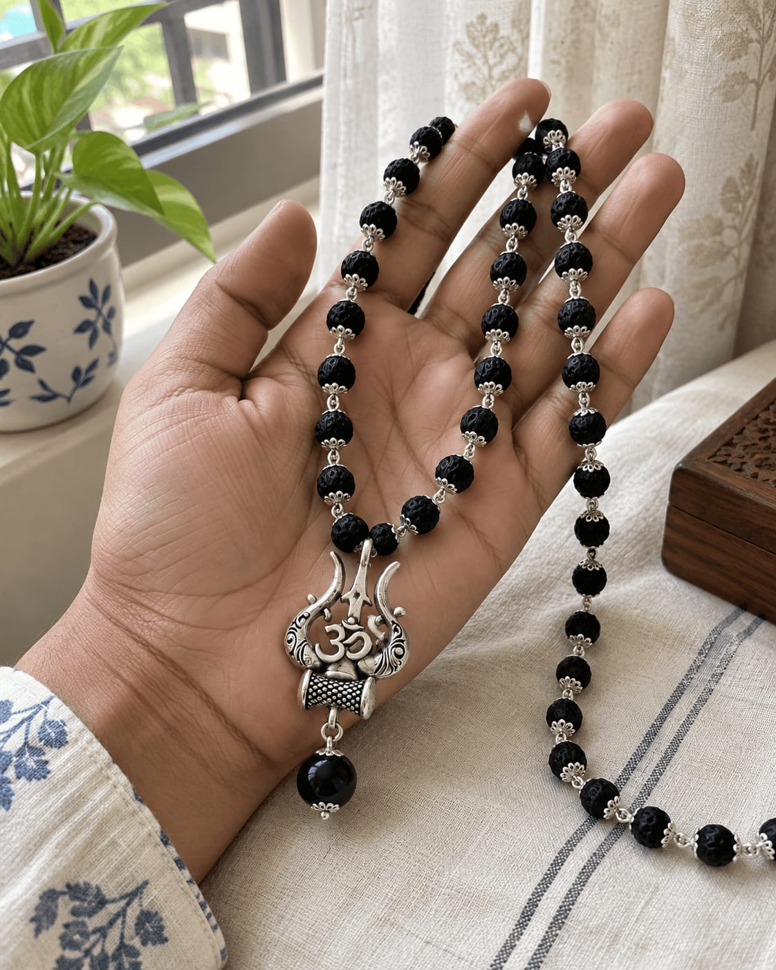 Customer photo review of Original Karungali Mala with Silver Plated Om Trishul Pendant