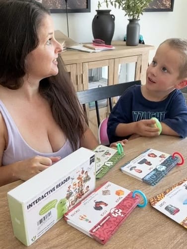Mother and son playing with Rexi and the word books.