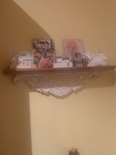 Customer's Jennifer French Provincial Wall Ledge Shelf styled with small decorative houses and a ceramic figure