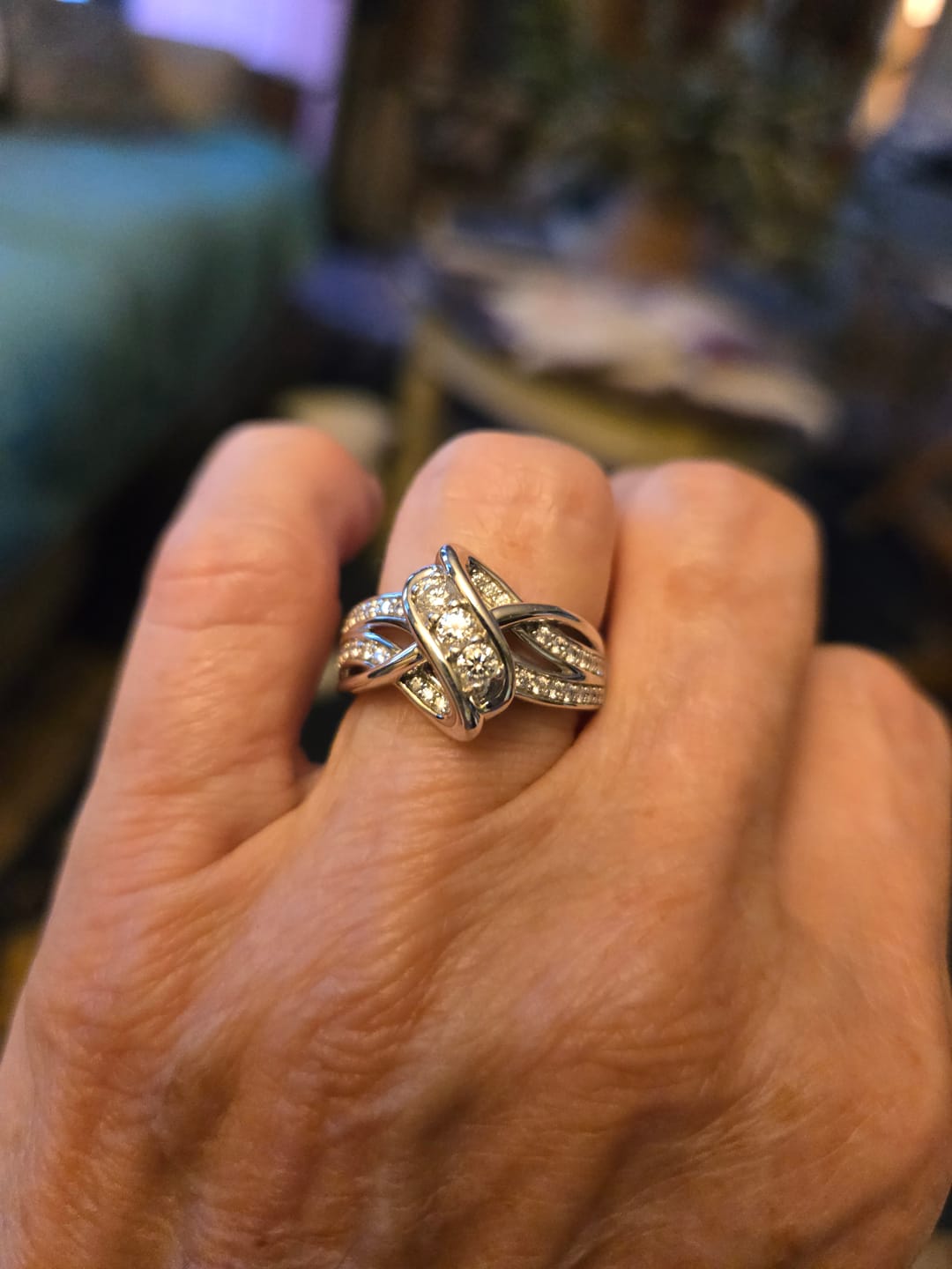 Customer photo review of Swirl Interlocking Criss-Cross Moissanite Wedding Band Ring