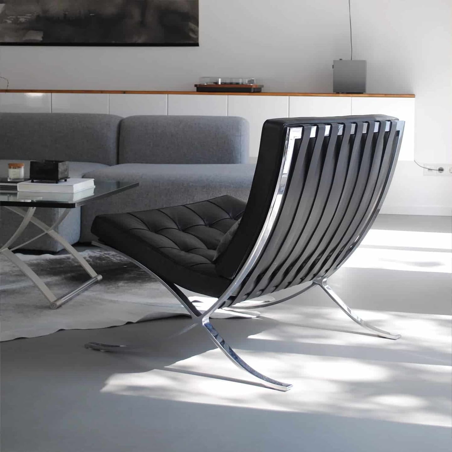Customer photo review of Fauteuil Lounge & Repose-Pieds – Cuir Véritable Noir et Structure Chromée Sculpturale