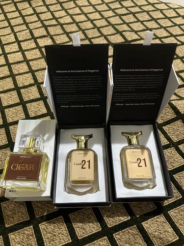 Customer's Royal Oud Collection perfumes, featuring two Castle21 bottles and one Cigar perfume in gift boxes.