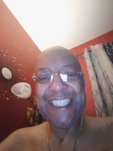 Customer's smiling face in a indoor setting, reviewer of Caviar Gold Caviar Collection Pre Rolls