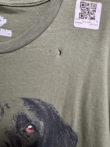 Customer's green Labrador Vinyl T-Shirt with an accidental cut in the fabric near the neck tag.