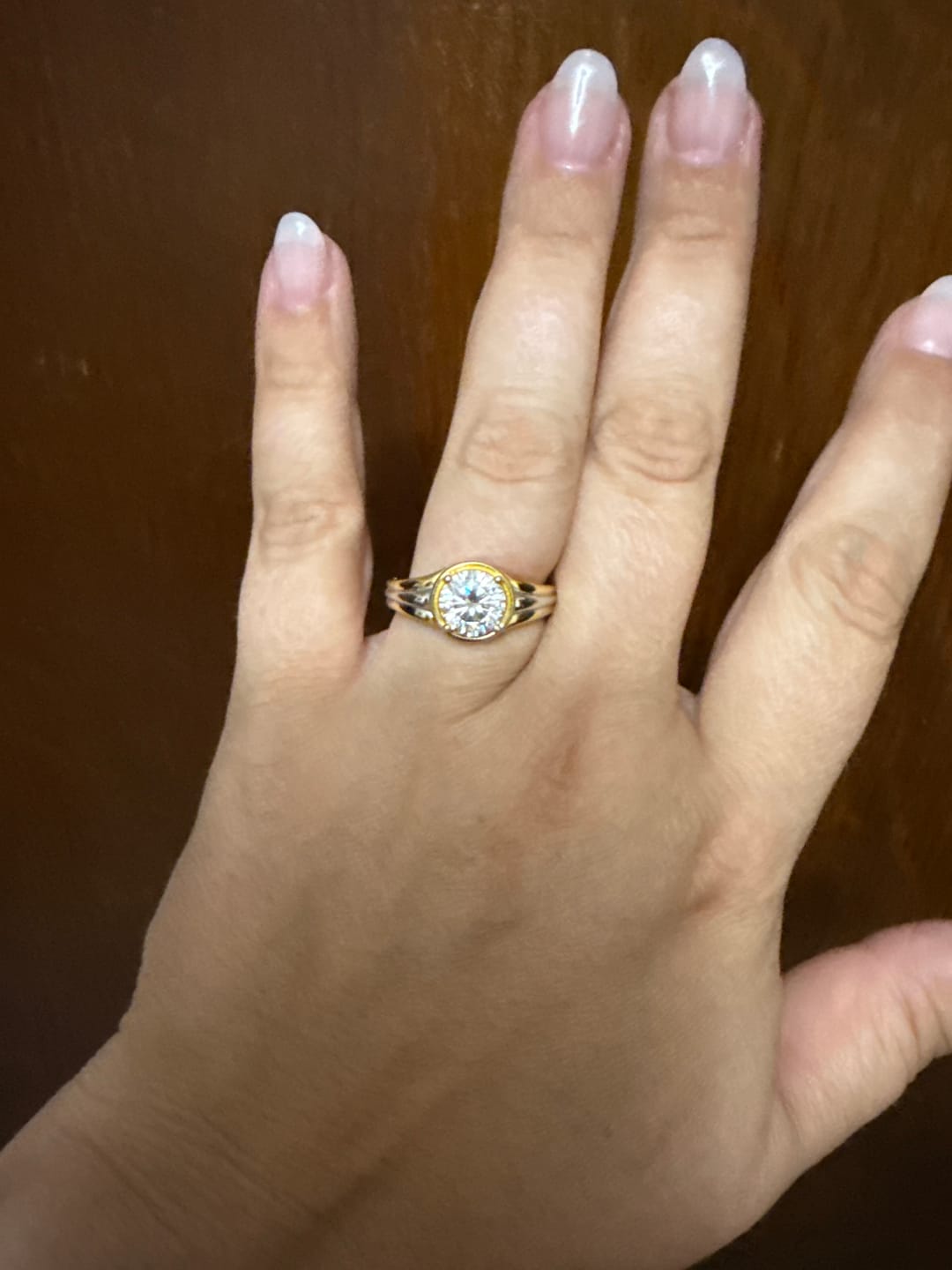Customer photo review of Solitaire Round Moissanite Streamlined Two-Tone Engagement Ring