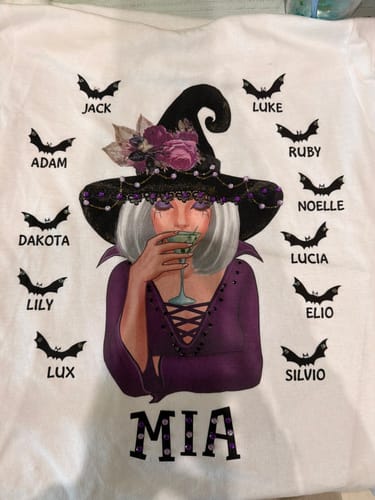 Customer's Halloween Witch shirt featuring a decorated witch, bats, and personalized names with added glitter gems.
