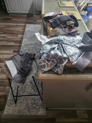 Customer's Streak-Free Boxers 3-Pack with camo and solid designs laid out on a kitchen counter.