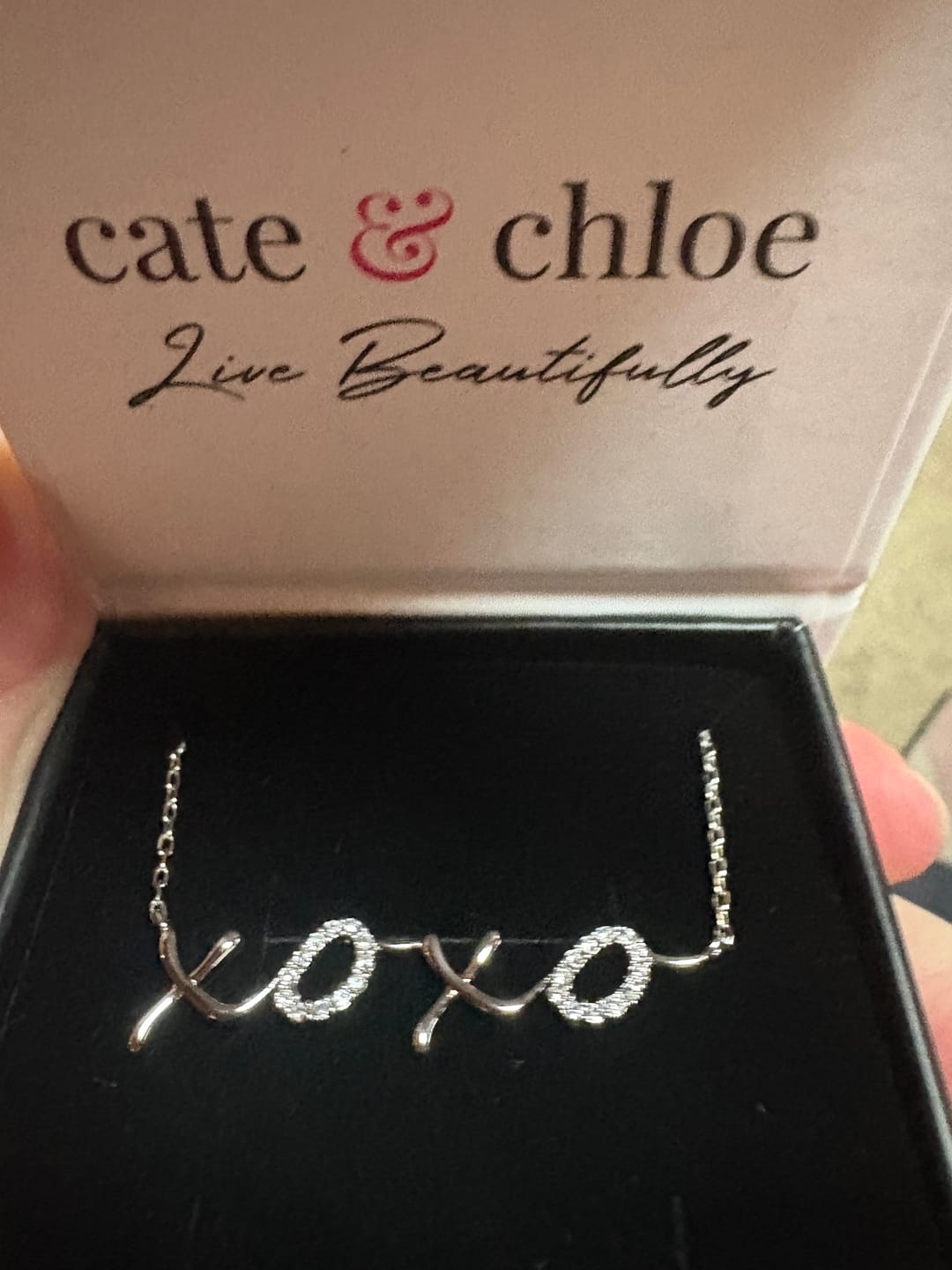Customer photo review of Jocelyn 18k White Gold Plated XOXO Pendant Necklace with Swarovski Crystals