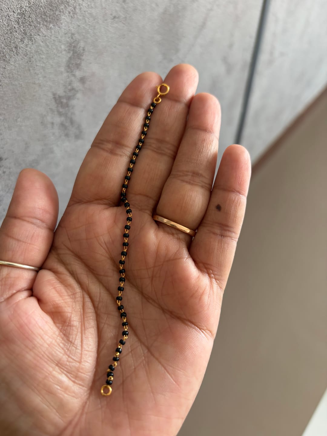 Customer photo review of Mini Mivraa - Baby Black Bead Bracelet & Anklet