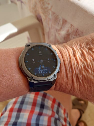 Customer's gray Gard Pro Ultra 3 smartwatch on their wrist, displaying the time and fitness metrics.