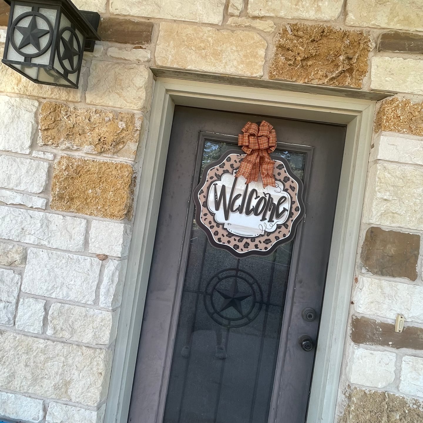 Customer photo review of Leopard Cheetah Welcome Door Hanger