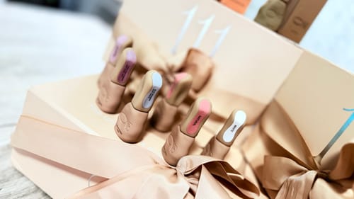 Customer's Creamy Rubber Base collection in a premium beige gift box with elegant ribbon.
