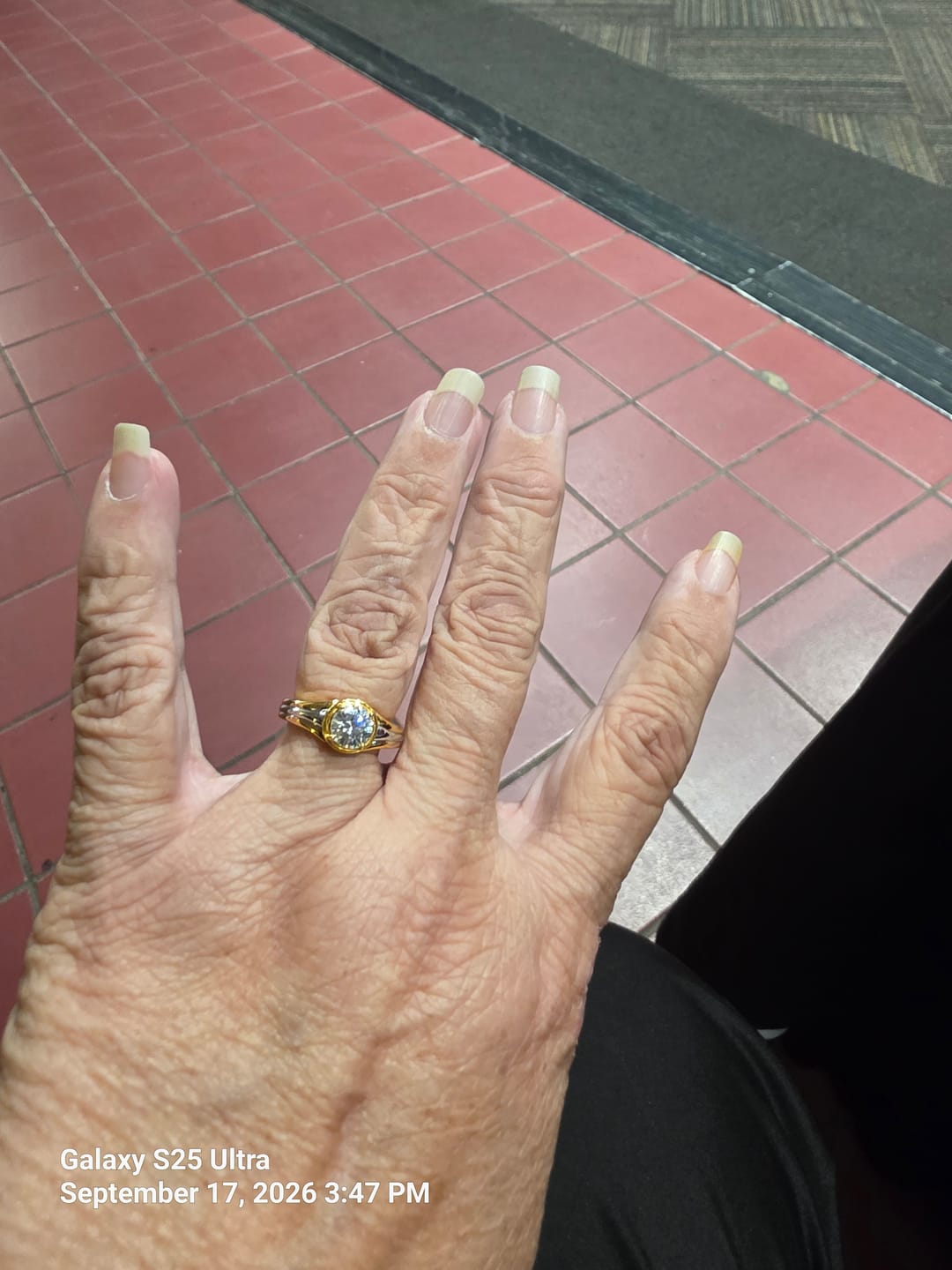 Customer photo review of Solitaire Round Moissanite Streamlined Two-Tone Engagement Ring