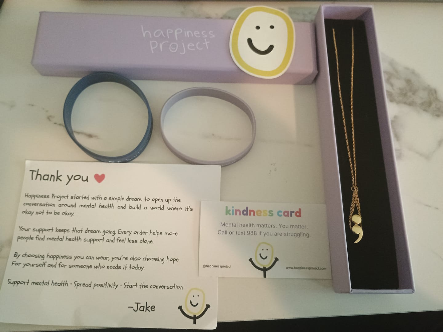 Customer photo review of Semicolon Pendant Necklace