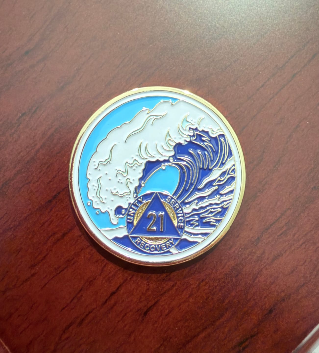 Customer photo review of 21 Year Sobriety Mint Crashing Wave Gold Plated AA Recovery Medallion - Twenty One Year Chip/Coin - Blue/White