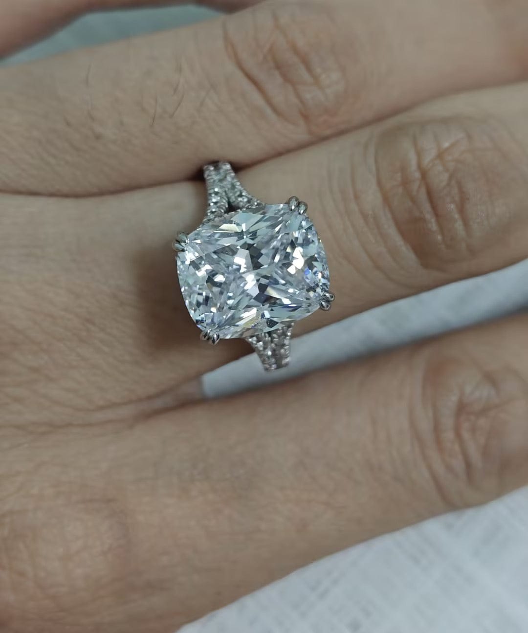 Customer photo review of S925 7.0Ct/4.0Ct Split Shank Cushion Cut Engagement Ring 18K White Gold Plated Travel Rings with Pavé Accents