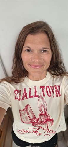 Customer's Small Town Smokeshow graphic midi tee in white, featuring red lighter graphic, worn in a portrait.