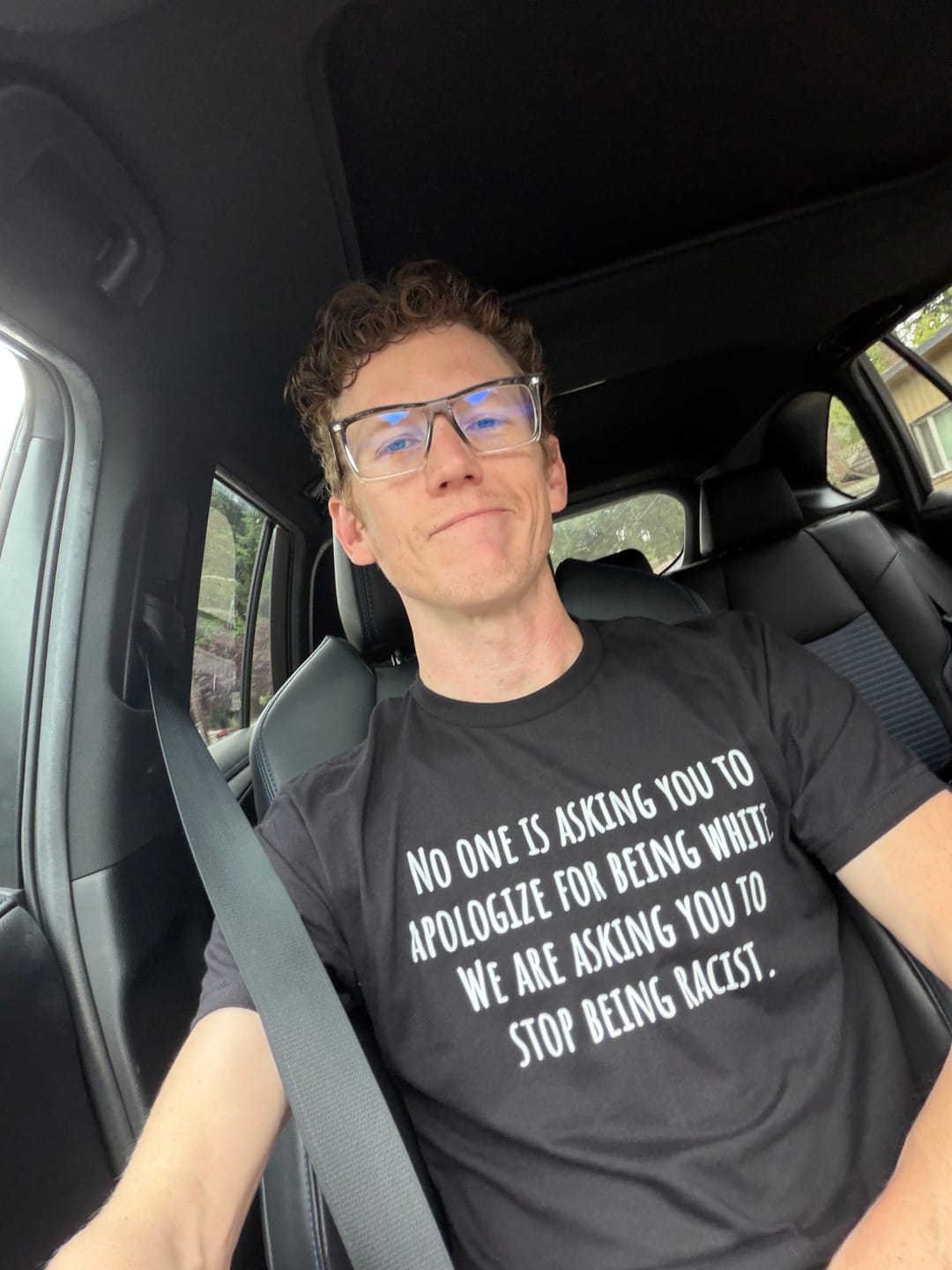 Customer photo review of No one is asking you to apologize for being white. We are asking you to stop being racist Unisex Tee