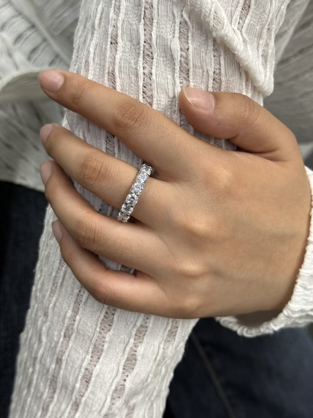 Customer photo review of Louily 5 Ct Luxury Eternity Round Cut Wedding Band In Sterling Silver