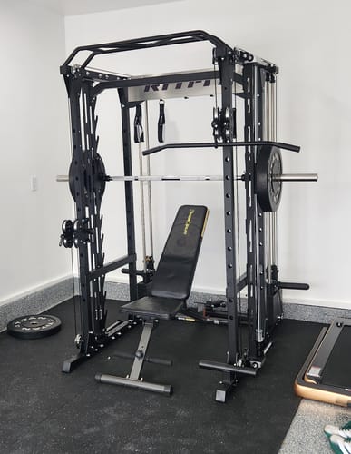 Customer's RitFit P9 Multi-Functional Modular Power Cage in a home gym, featuring a black frame and gym bench.