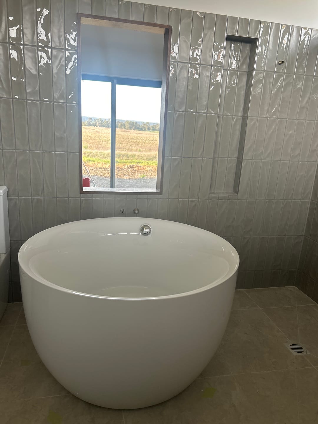 Customer photo review of Antique Finish Round Soaking Bath Stand Alone Modern Bath Tub