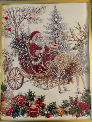 Customer's diamond painting art showing Santa in a sleigh pulled by reindeer, decorated with festive ornaments.