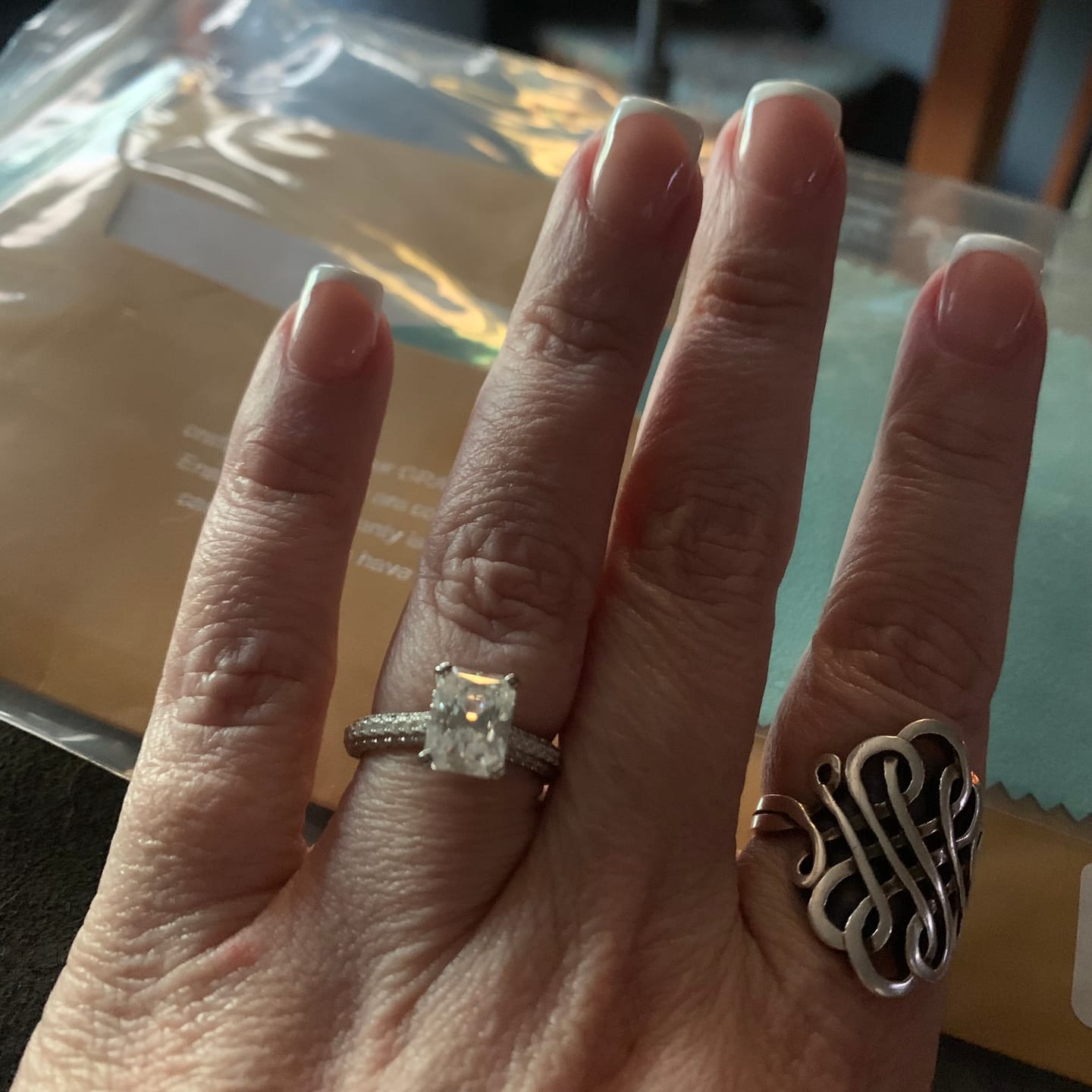 Customer photo review of Hidden Halo Radiant Moissanite Triple Row Pave Engagement Ring
